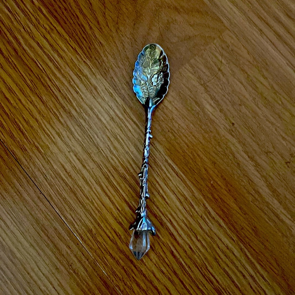 Silver spoon little diamond on the back and it has flowers on